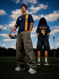 Male and Female Model wearing Down Under Football Jersey