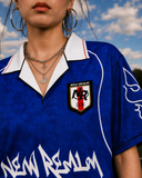 Close-up of the Blue Sakura Football Jersey crest, collar, and sleeve detail
